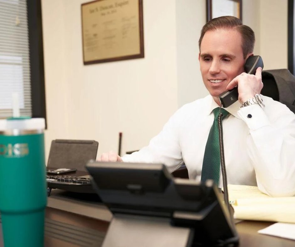 Ian Duncan on the phone with one of his clients