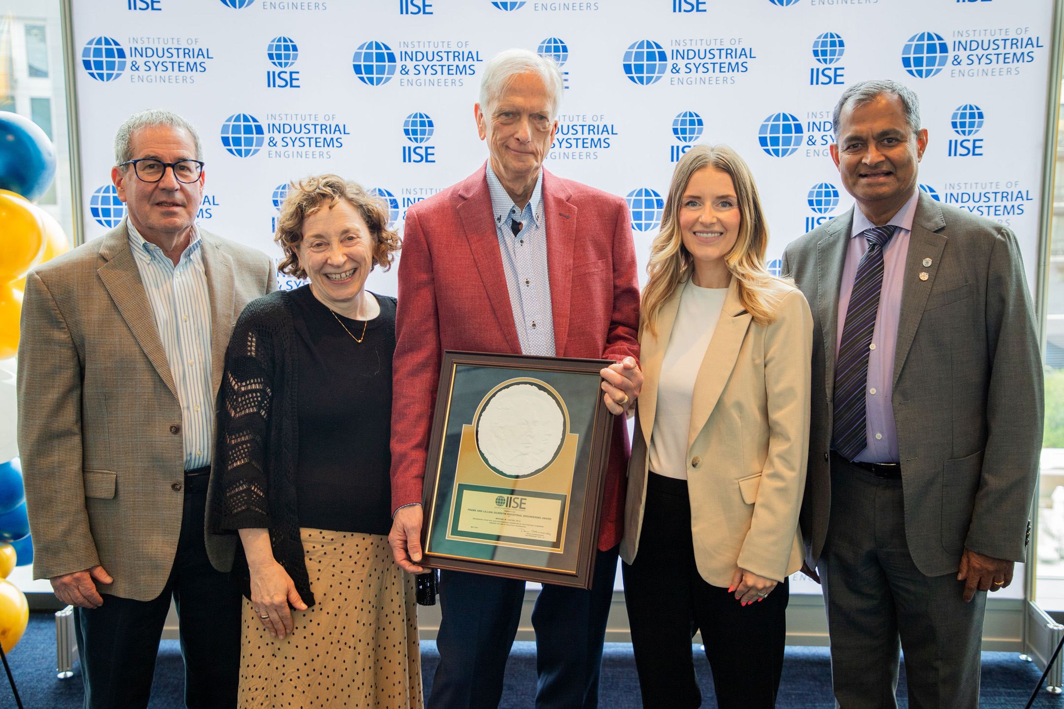 Michael Carter, center, IISE Gilbreth Award winner